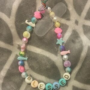 ‘Blessed’ phone charm wristlet strap